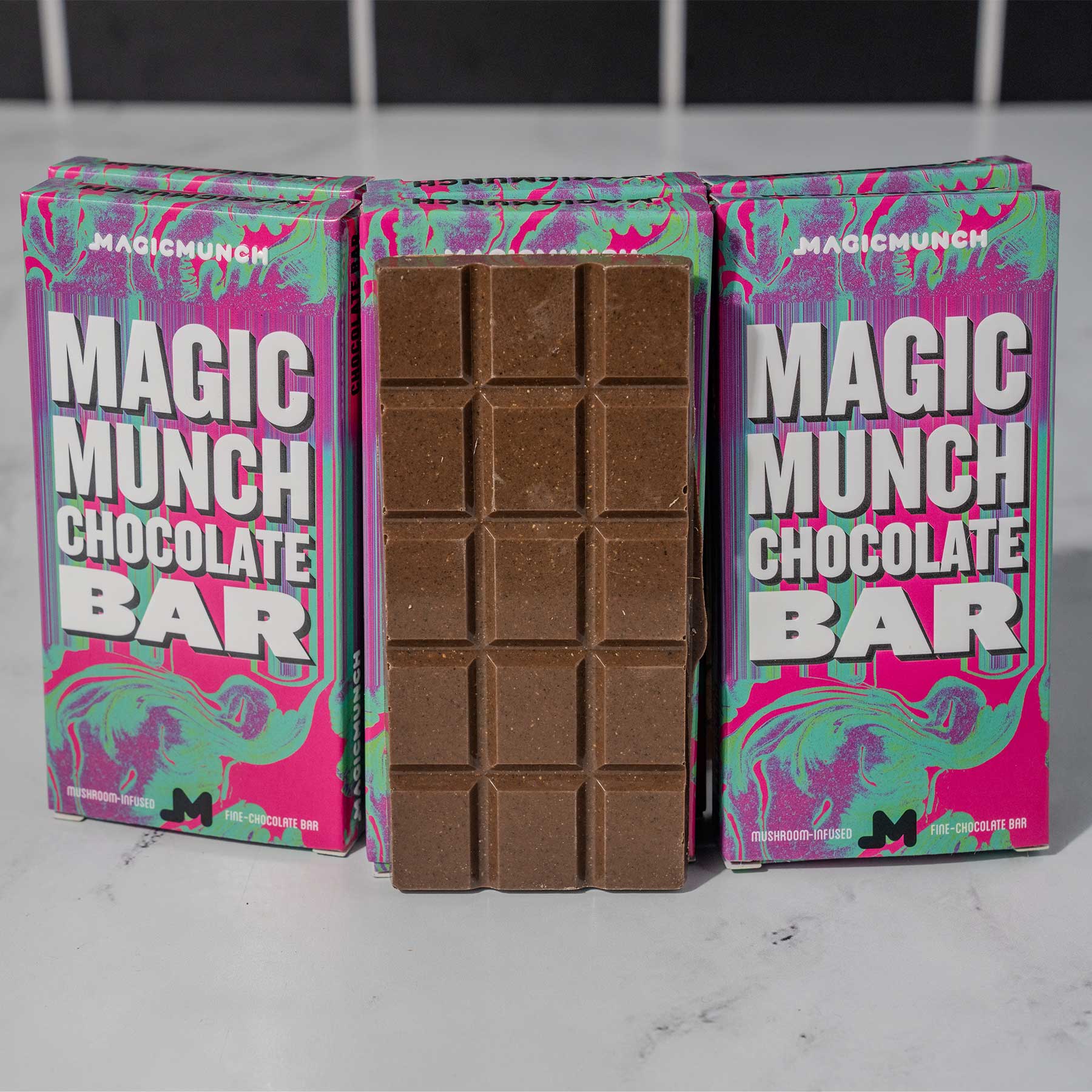 Magic Munch Chocolate Bar Standing Up in front of six Magic Munch Chocolate Bar Boxes - 4.5g of Mushrooms per bar